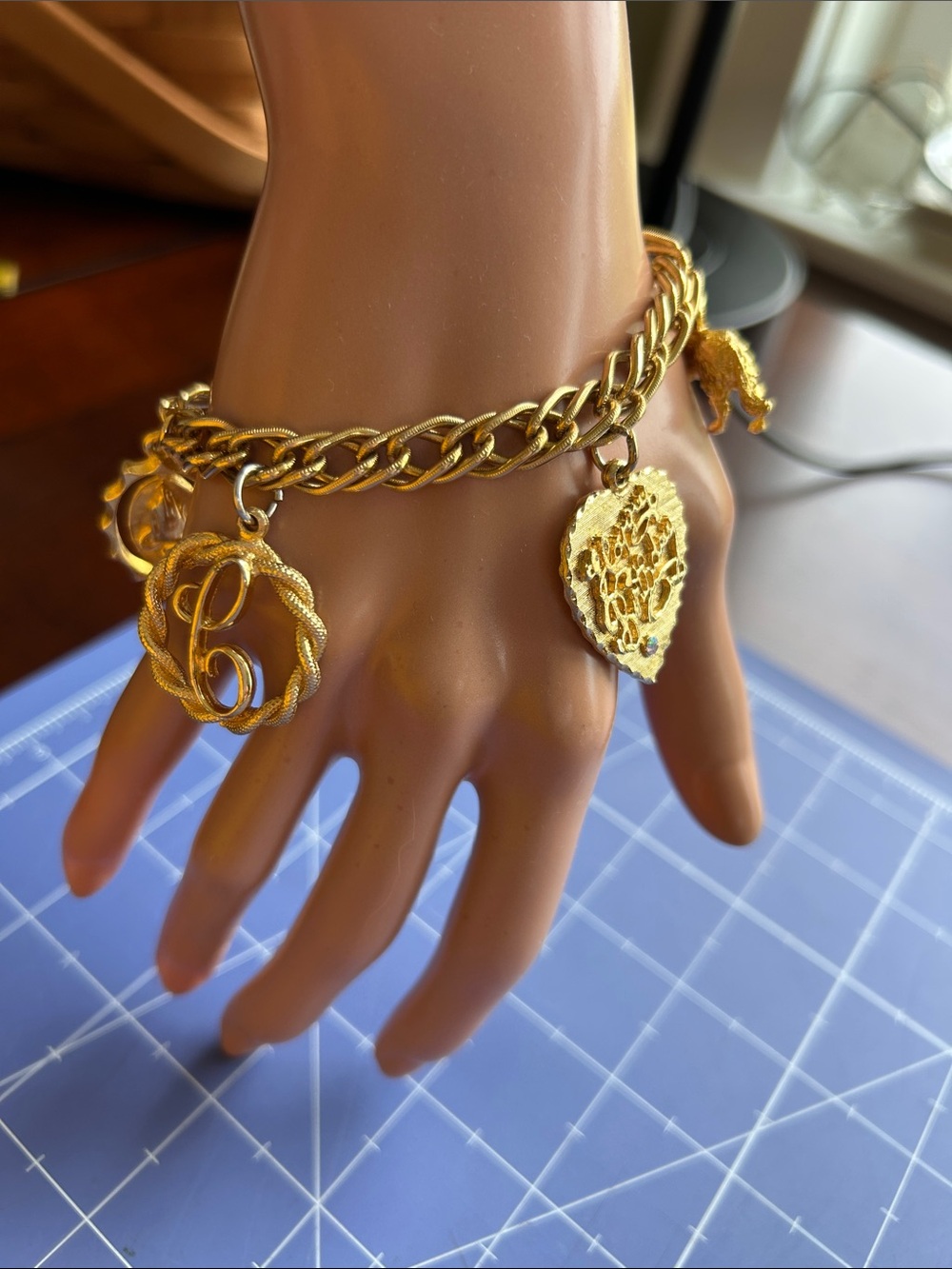 Chunky gold-tone charm bracelet fold over clasp Evc 7” length 4 charms total